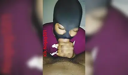Lusty black amateur chick wears a mask and gives a long wet and sloppy blowjob