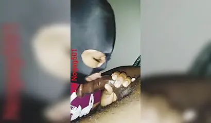 Lusty black amateur chick wears a mask and gives a long wet and sloppy blowjob