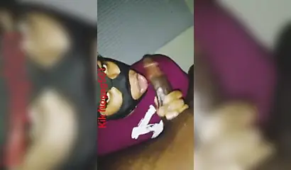 Lusty black amateur chick wears a mask and gives a long wet and sloppy blowjob