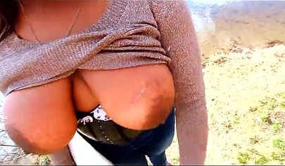 Curvy and adorable black teenie gives an outdoor blowjob and fucks doggy style