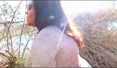 Curvy and adorable black teenie gives an outdoor blowjob and fucks doggy style