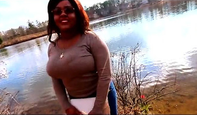Curvy and adorable black teenie gives an outdoor blowjob and fucks doggy style