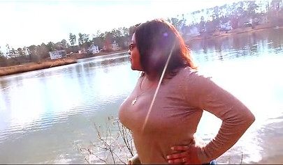Curvy and adorable black teenie gives an outdoor blowjob and fucks doggy style