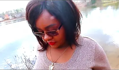 Curvy and adorable black teenie gives an outdoor blowjob and fucks doggy style