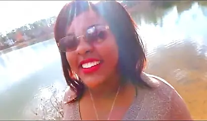 Curvy and adorable black teenie gives an outdoor blowjob and fucks doggy style