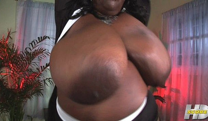Thick black mommy with huge tits and a big ass strips naked and fucks her pussy