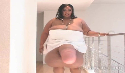 Horny BBW with giant tits fools around with a massive fake dick and masturbates