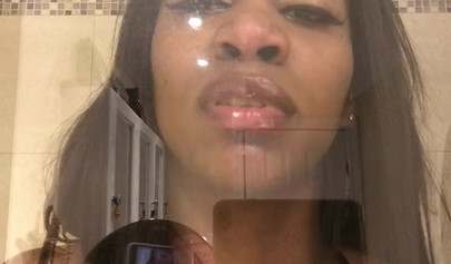 Black amateur stripper kisses the glass and is horny while under the shower