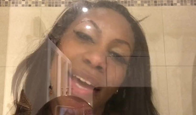 Black amateur stripper kisses the glass and is horny while under the shower