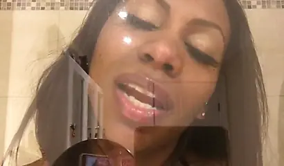 Black amateur stripper kisses the glass and is horny while under the shower