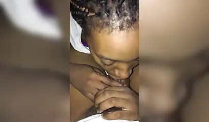 Horny black amateur babe gives a long and sloppy blowjob to a massive fat schlong