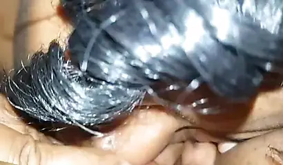 Luscious black lesbian chick enjoys giving a sensual licking to another ebony