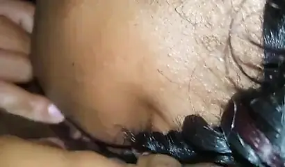 Luscious black lesbian chick enjoys giving a sensual licking to another ebony