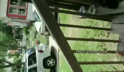 Horny black babe gives a long and sloppy blowjob on a front porch during daylight