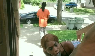 Horny black babe gives a long and sloppy blowjob on a front porch during daylight