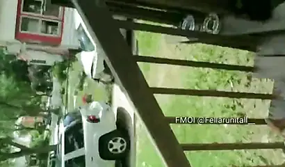 Horny black babe gives a long and sloppy blowjob on a front porch during daylight