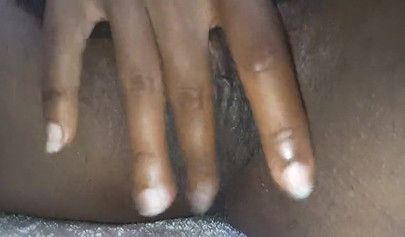 Dashing ebony babe enjoys her milkshake before fingering her wet cunt on webcam