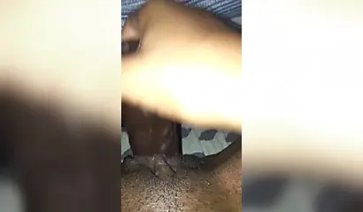 Kinky and naughty black chick gives a long and dirty handjob to a big black cock