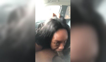Horny ebony amateur chick gives a long and sloppy blowjob to a big cock in a car