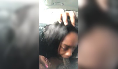 Horny ebony amateur chick gives a long and sloppy blowjob to a big cock in a car
