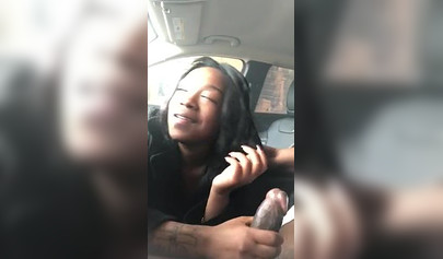 Horny ebony amateur chick gives a long and sloppy blowjob to a big cock in a car
