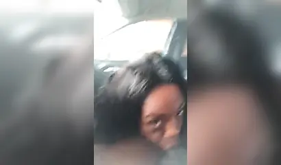 Horny ebony amateur chick gives a long and sloppy blowjob to a big cock in a car