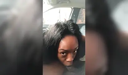 Horny ebony amateur chick gives a long and sloppy blowjob to a big cock in a car