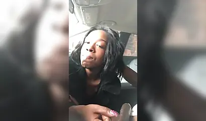 Horny ebony amateur chick gives a long and sloppy blowjob to a big cock in a car