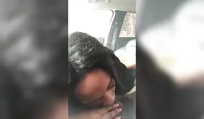 Horny ebony amateur chick gives a long and sloppy blowjob to a big cock in a car