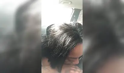 Horny ebony amateur chick gives a long and sloppy blowjob to a big cock in a car