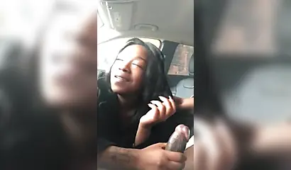 Horny ebony amateur chick gives a long and sloppy blowjob to a big cock in a car