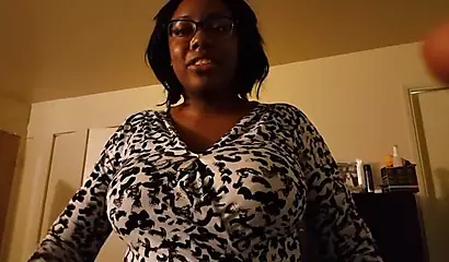 Cute and chubby black amateur with glasses and curves gives a blowjob and a titjob