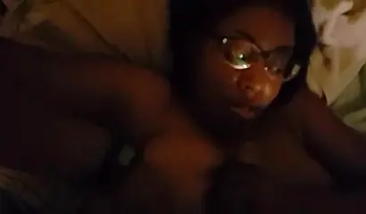 Cute and chubby black amateur with glasses and curves gives a blowjob and a titjob