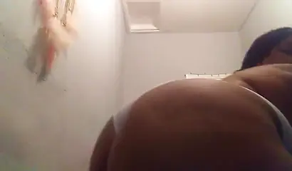 Lusty ebony girl with huge tits enjoys filming herself stripping and fingering