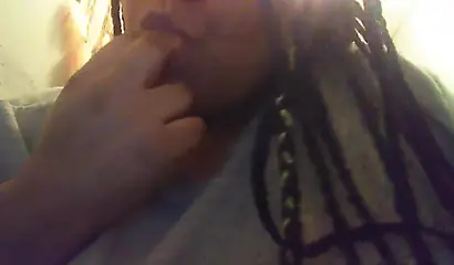 Lusty ebony girl with huge tits enjoys filming herself stripping and fingering