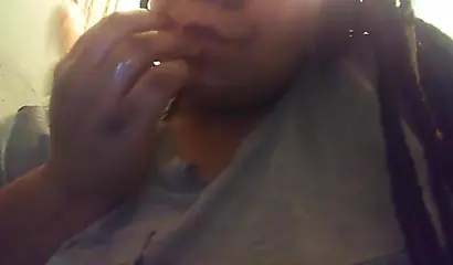 Lusty ebony girl with huge tits enjoys filming herself stripping and fingering