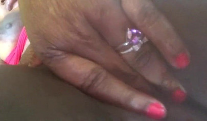 Amateur black babe with big curves records a close up video while fucking her cunt