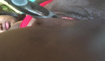 Amateur black babe with big curves records a close up video while fucking her cunt