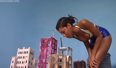 Super hot and sexy ebony giantess walks around a small city showing her attributes