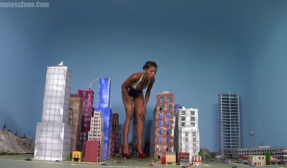 Super hot and sexy ebony giantess walks around a small city showing her attributes