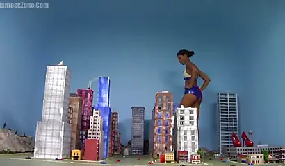 Super hot and sexy ebony giantess walks around a small city showing her attributes