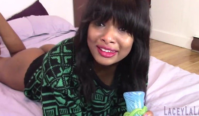 Black babe is all smiles as she toys her pussy with a buttplug already in her