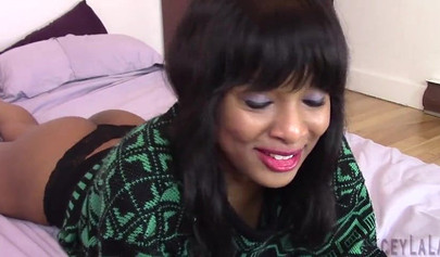 Black babe is all smiles as she toys her pussy with a buttplug already in her