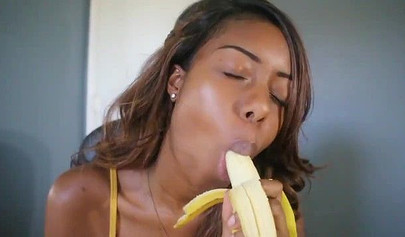 ASMR video of a beautiful black babe teasing you by sensually sucking on a banana