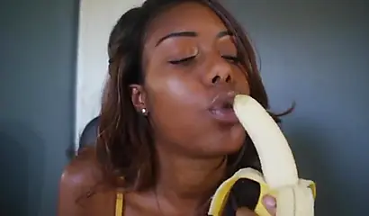 ASMR video of a beautiful black babe teasing you by sensually sucking on a banana