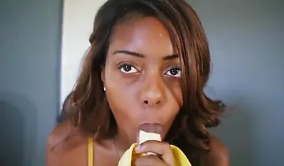 ASMR video of a beautiful black babe teasing you by sensually sucking on a banana