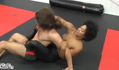 Athletic ebony babe wrestles topless with a white guy and subdues him erotically