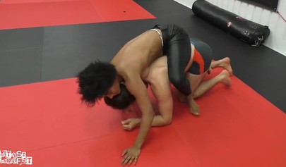 Athletic ebony babe wrestles topless with a white guy and subdues him erotically