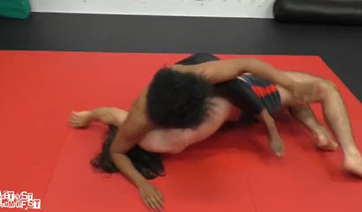 Athletic ebony babe wrestles topless with a white guy and subdues him erotically