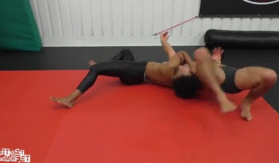Athletic ebony babe wrestles topless with a white guy and subdues him erotically